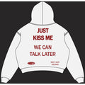 White NWAYTA Just Kiss Me oversized cropped hoodie back view with dark red quote design, padded on white square canvas