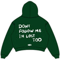 Green oversized cropped hoodie back view with DON'T FOLLOW ME I'M LOST TOO text and NWAYTA oval logo badge, padded on white square canvas